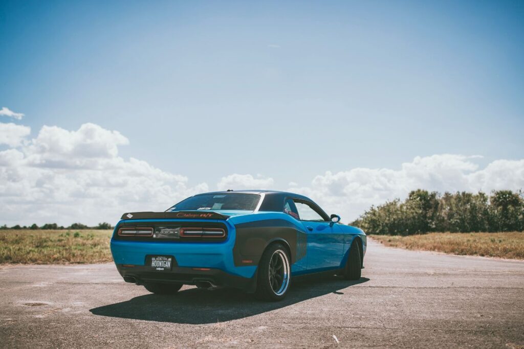 Blue Dodge sports car in the middle of the road