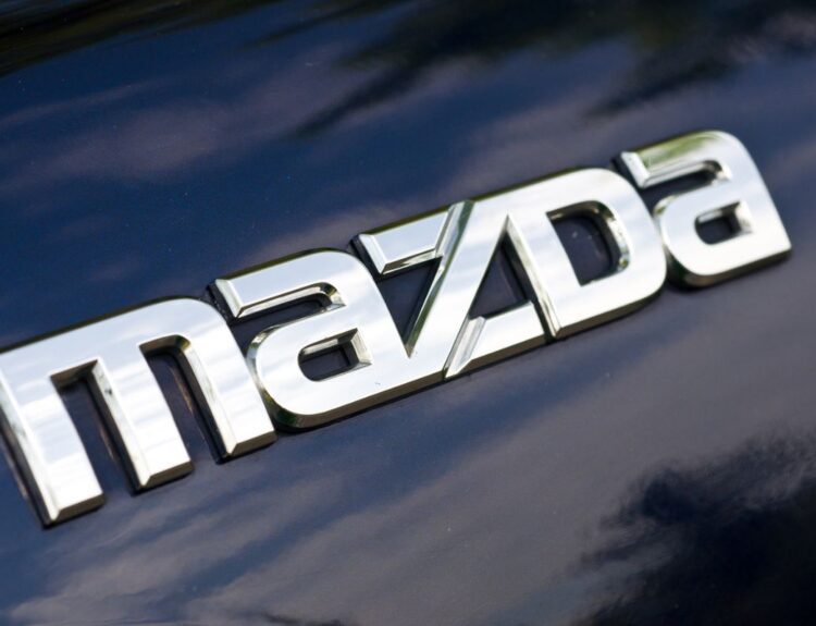 Close up of Mazda logo. Who Owns Mazda blog post