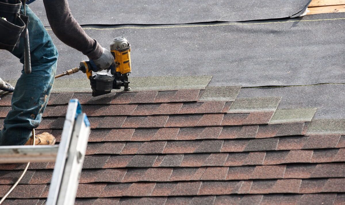 Roofer installing new rood on residential home. Who Owns B.R. Jones Roofing Co article