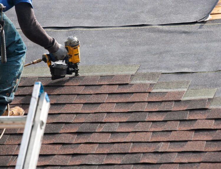 Roofer installing new rood on residential home. Who Owns B.R. Jones Roofing Co article