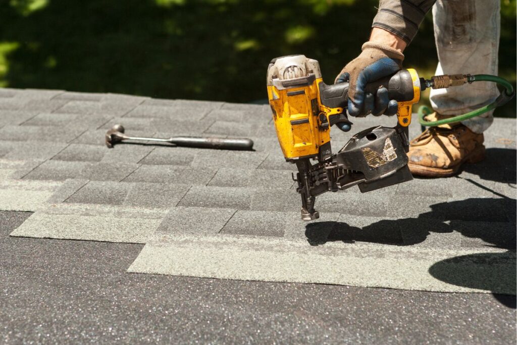 Roofer replacing roof shingles. Who Owns B.R. Jones Roofing Co article