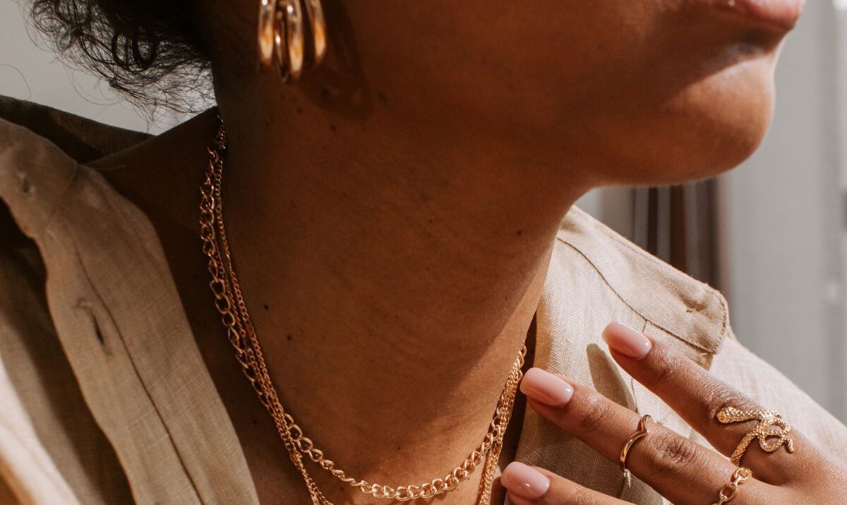 Young woman wearing gold jewelry