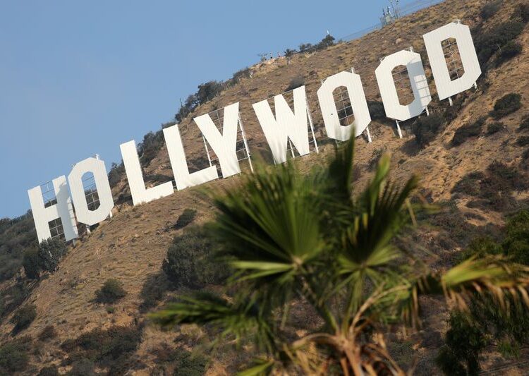 Hollywood workers union reaches pay, AI-use deal with top studios