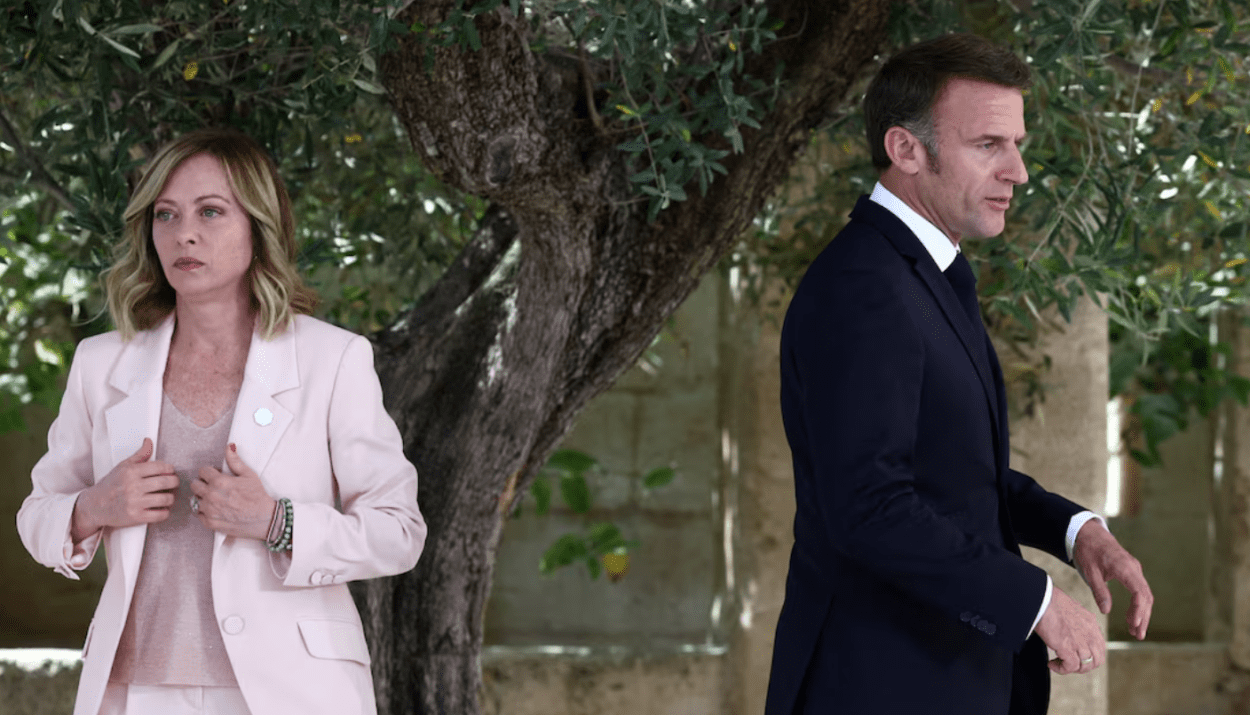 French President Emmanuel Macron walks next to Italy's Prime Minister Giorgia Meloni on the first day of the G7 summit, at the Borgo Egnazia resort, in Savelletri, Italy June 13, 2024. REUTERS/Guglielmo Mangiapane/File Photo