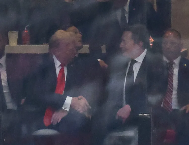 Musk and Trump shake hands