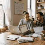 Family discussing finances at kitchen table
