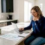 Investor reviewing portfolio at kitchen table