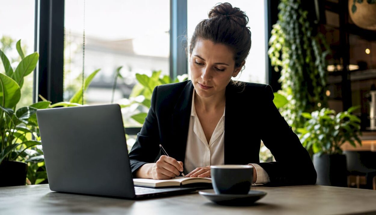 Professional woman studying at home desk