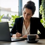 Professional woman studying at home desk