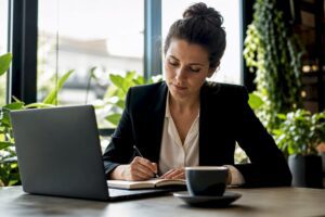 Professional woman studying at home desk