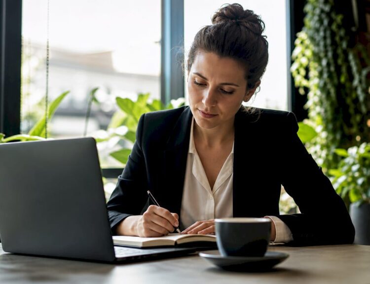 Professional woman studying at home desk