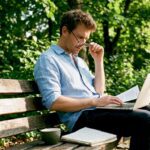Economist studying behavioral economics at desk