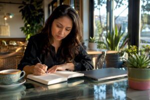 Woman budgeting at home office desk