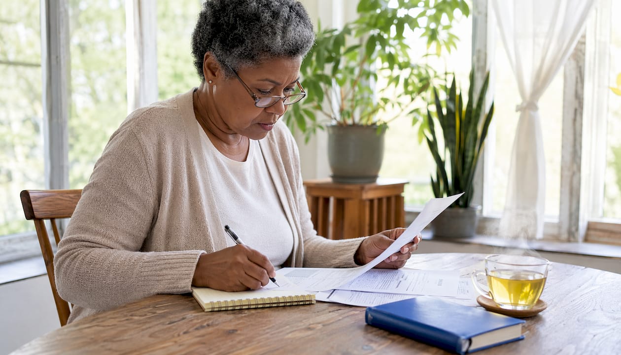 Woman reviewing Social Security tax documents