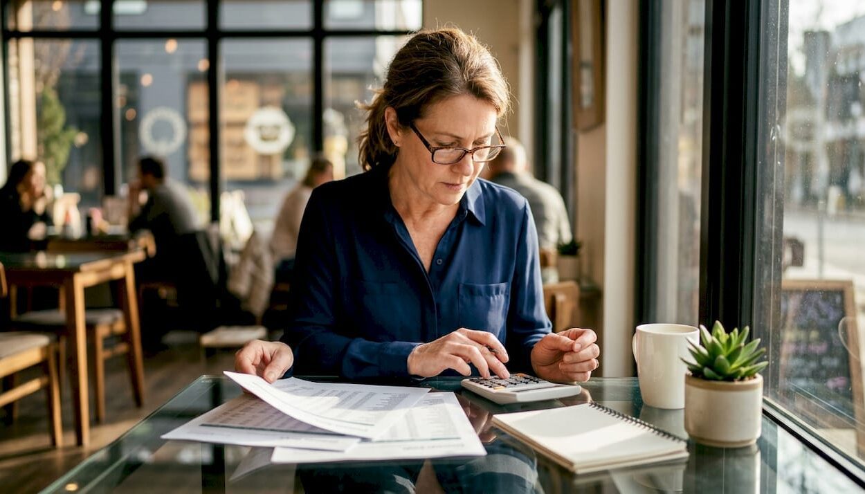 Investor reviewing dividend stock reports at home desk
