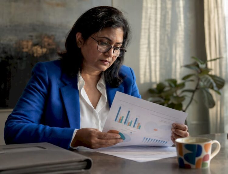 Investor reviewing diversified portfolio papers