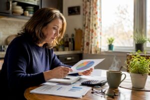 Woman reviewing diversified investment documents