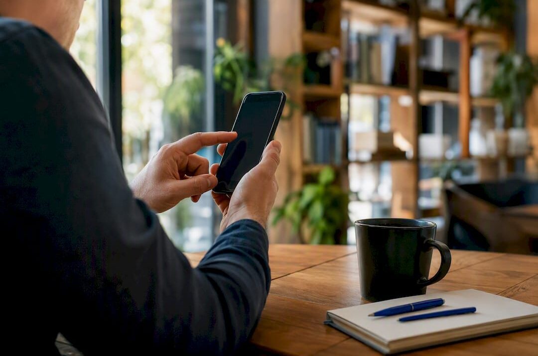 Hands setting up smartphone authentication