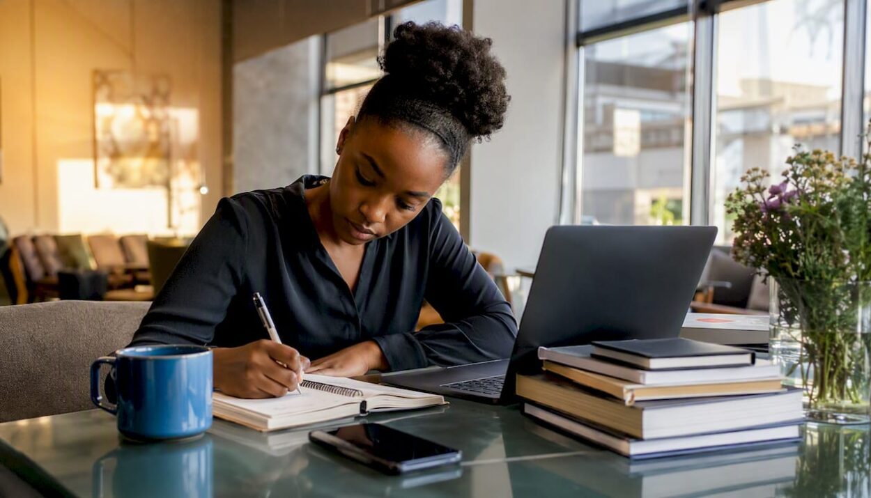 Woman planning income streams at home desk