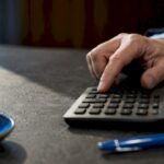 Hand entering inputs into financial calculator
