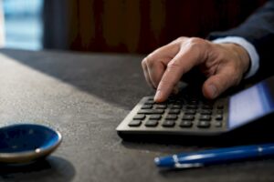 Hand entering inputs into financial calculator