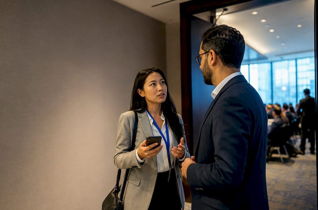 Professionals talking after a conference session