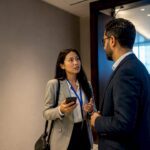 Professionals talking after a conference session
