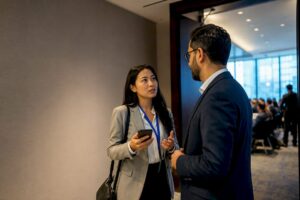 Professionals talking after a conference session
