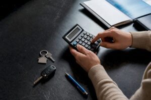 Calculator beside household asset valuation items